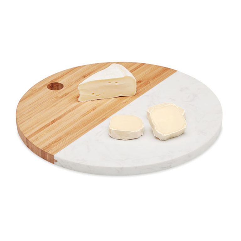 Gadget with logo Apéro board HANNSU Apéro board in marble and bamboo. Circular shape. This circular Apéro board or cheese platter has a luxurious and premium look thanks to the white marble. The bamboo part gives it a more natural look. Bamboo is a natural product, there may be slight variations in colour and size per item, which can affect the final decoration outcome. Available color: Wood Dimensions: Ø25X1CM Height: 1 cm Diameter: 25 cm Volume: 2.3 cdm3 Gross Weight: 1.185 kg Net Weight: 1.058 kg Magnus Business Gifts is your partner for merchandising, gadgets or unique business gifts since 1967. Certified with Ecovadis gold!
