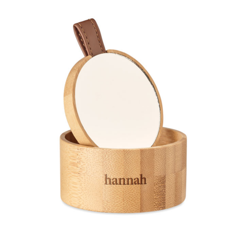 Gadget with logo Mirror jewellery box TREASURE Small bamboo jewellery box with logo with detachable mirror. Keep your earrings, bracelets, necklaces and rings safely stored away in this stylish and natural looking jewellery box. The inside of the lid has a small mirror. Bamboo is a natural product, there may be slight variations in colour and size per item, which can affect the final decoration outcome. Available color: Bamboo Dimensions: Ø8X4CM Height: 4 cm Diameter: 8 cm Volume: 0.43 cdm3 Gross Weight: 0.1 kg Net Weight: 0.077 kg Magnus Business Gifts is your partner for merchandising, gadgets or unique business gifts since 1967. Certified with Ecovadis gold!