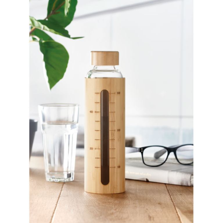 Water bottle with logo Bamboo SHAUMAR Borosilicate glass water bottle with logo with bamboo cover and lid and measurement detail. Capacity: 600 ml. The bamboo cover has a handy opening with a measurement detail. This way you can always see how much liquid there is left for you to drink. The bamboo gives this bottle a very natural look. Borosilicate glass can hold both cold and hot liquids, so you can bring your favourite warm drinks with you in this flask. Available color: Wood Dimensions: Ø7X24.5CM Height: 24.5 cm Diameter: 7 cm Volume: 1.9 cdm3 Gross Weight: 0.45 kg Net Weight: 0.399 kg Magnus Business Gifts is your partner for merchandising, gadgets or unique business gifts since 1967. Certified with Ecovadis gold!