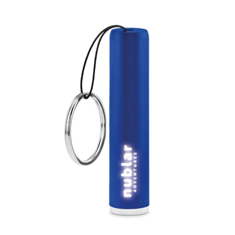 Gadget with logo Key ring LED SANLIGHT LED bulb torch in ABS with key ring. The barrel includes a LED light to illuminate the engraved logo. 3 AG3 batteries included. Available color: Royal Blue, Red, Orange, Black, Silver Dimensions: Ø1,3X6,5 CM Height: 6.5 cm Diameter: 1.3 cm Volume: 0.054 cdm3 Gross Weight: 0.013 kg Net Weight: 0.01 kg Magnus Business Gifts is your partner for merchandising, gadgets or unique business gifts since 1967. Certified with Ecovadis gold!